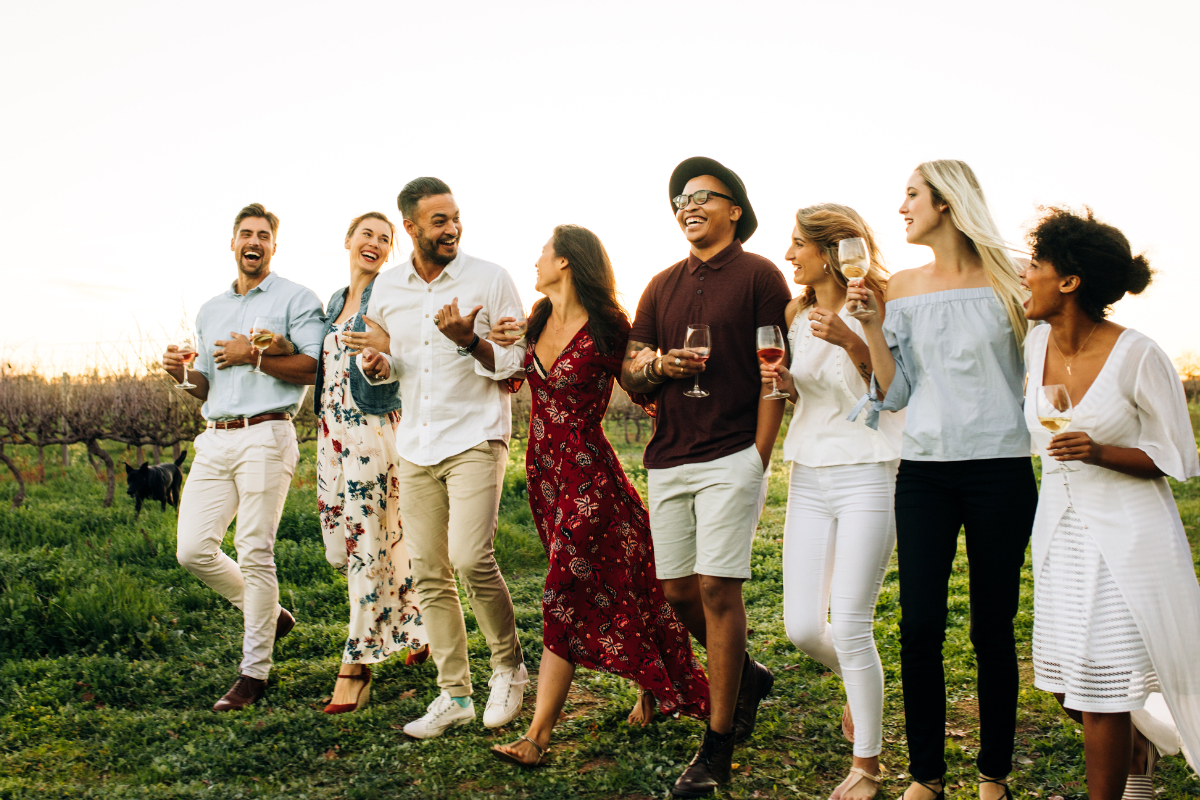 Friends Walking Through A Vineyard 1200X800