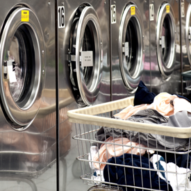 Row Of Washers With Cart Of Clothes 600X600