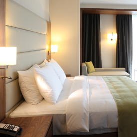 Hotel Laundry With Green Bedding 600X600